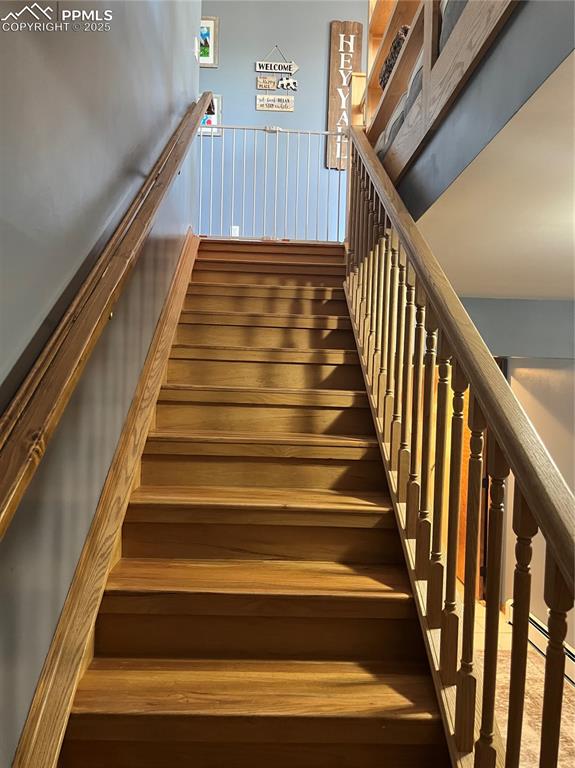 Image 18 of 28: Staircase from the lower entrance to upstairs.