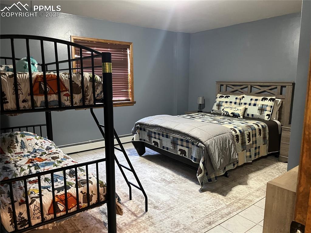 Image 20 of 28: One of the 2 lower bedrooms.