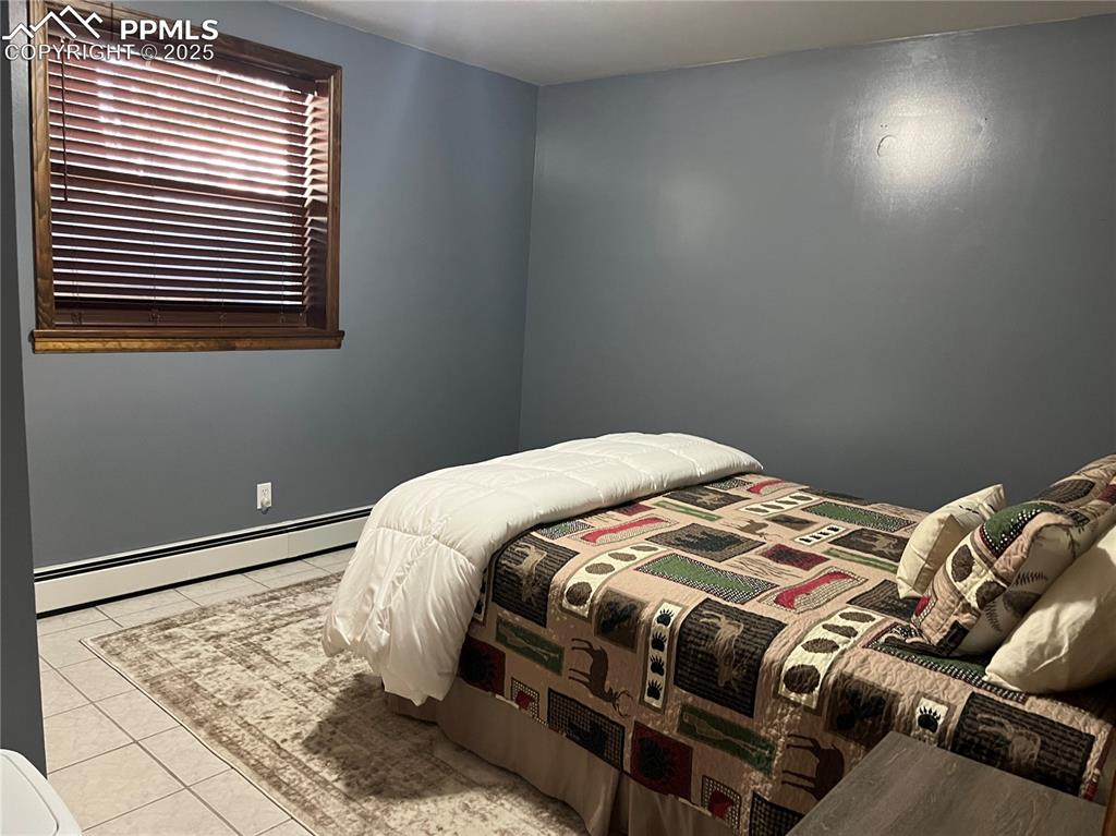 Image 21 of 28: 4 bedrooms total, this one is in the lower as well. Washer and dryer and