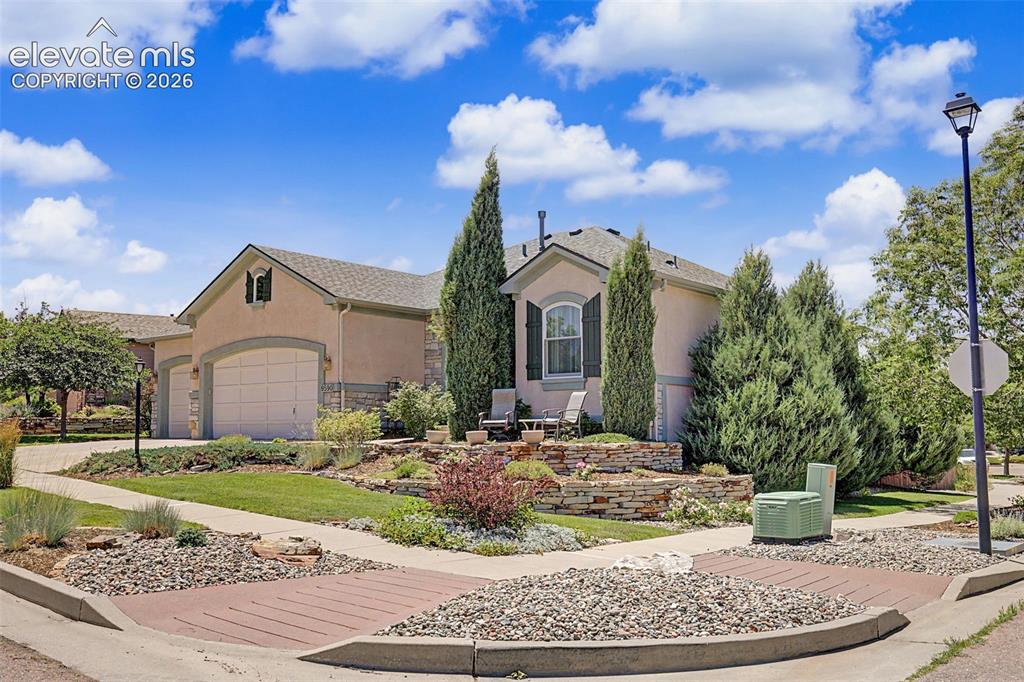 Image 2 of 31: Corner lot is fully landscaped.
