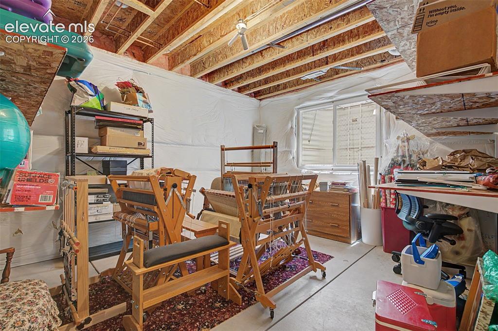 Image 24 of 31: This unfinished space is currently being used as storage; it can be finishe