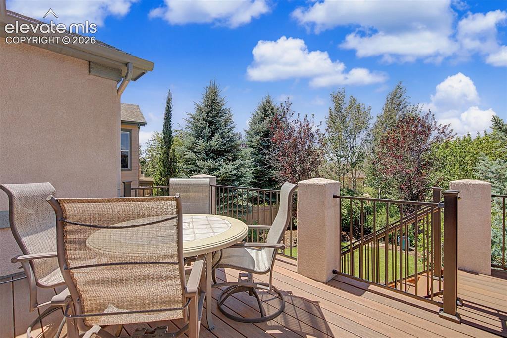 Image 25 of 31: Composite deck with iron rails faces west.