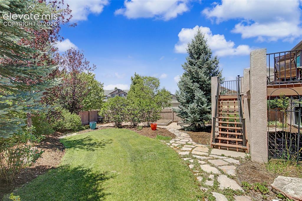 Image 26 of 31: Beautifully landscaped yard.