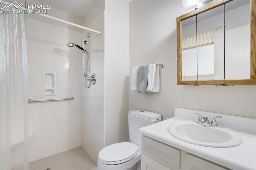 Image 15 of 45: Primary Bathroom with roll/walk-in shower