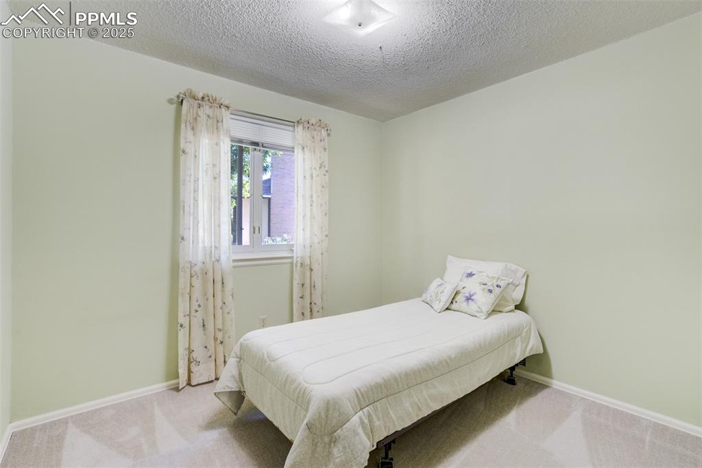 Image 17 of 45: Second bedroom- main level