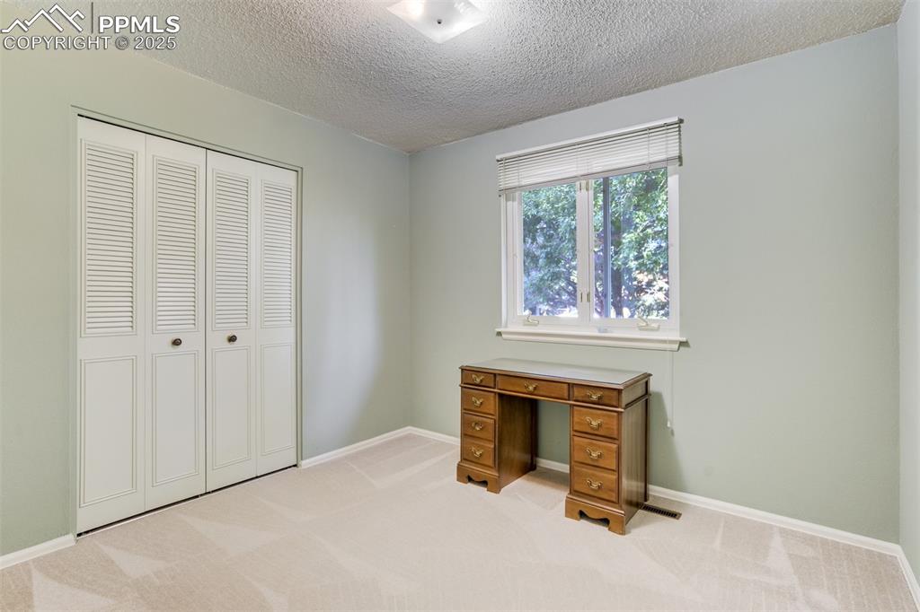 Image 20 of 45: Third bedroom- main level