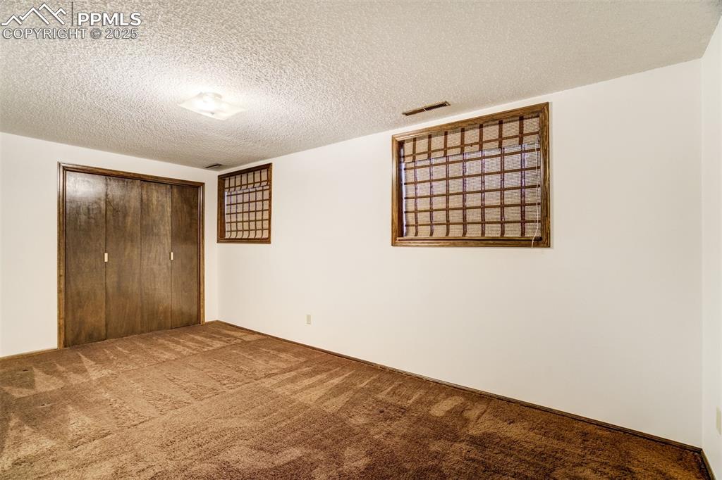 Image 25 of 45: Fourth bedroom- basement