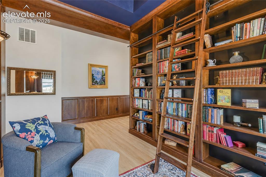 Image 10 of 46: Open-concept living space featuring high ceilings custome woodwork to match