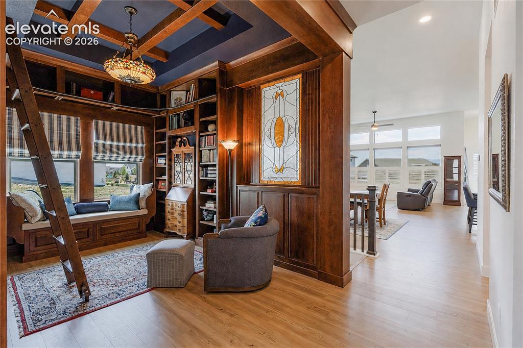 Image 11 of 46: Open-concept living space featuring high ceilings custome woodwork to match