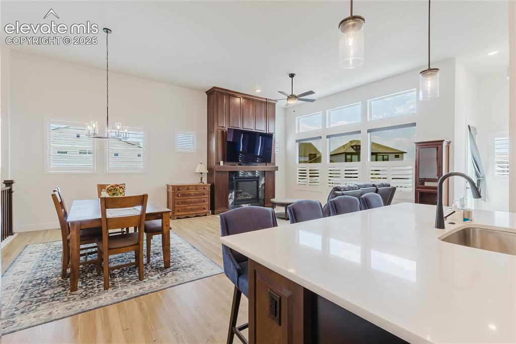 Image 19 of 46: High ceilings, multiple windows with plantation shutters, recessed lighting