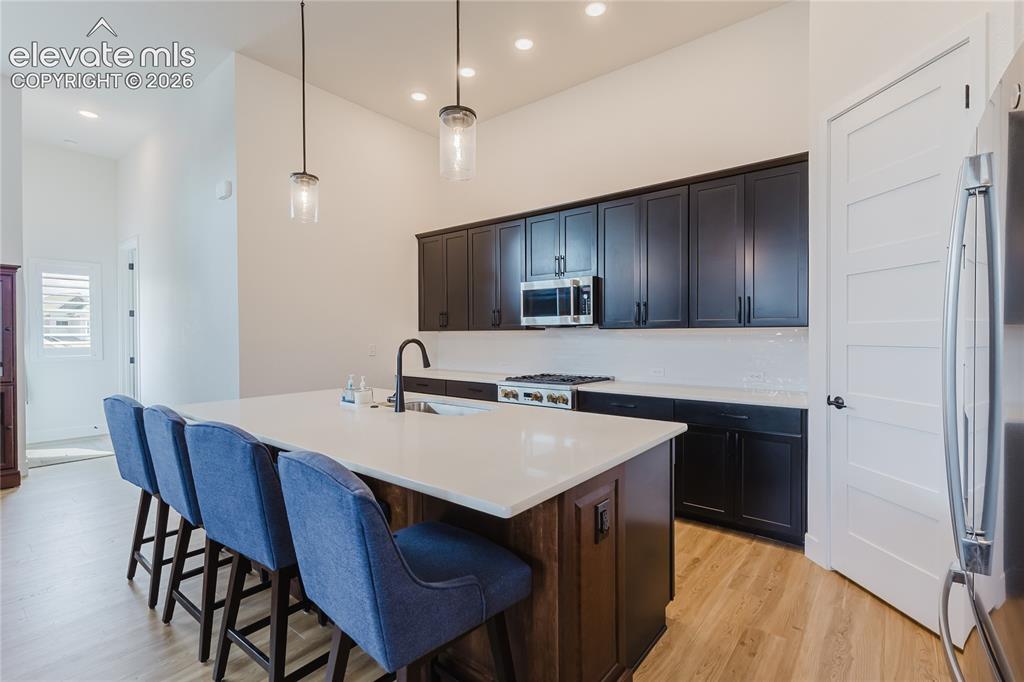 Image 20 of 46: Recessed lighting, ceiling fan, carpet flooring, light walls and dedicated 