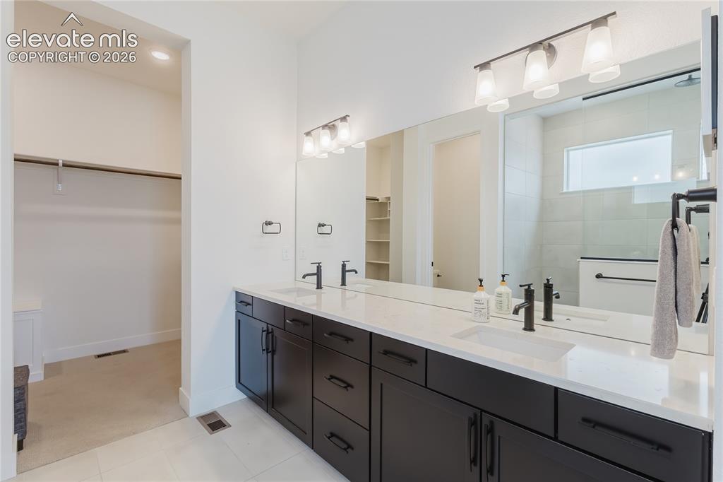 Image 27 of 46: Spacious recreatoin room in the lower level with recessed lighting and carp