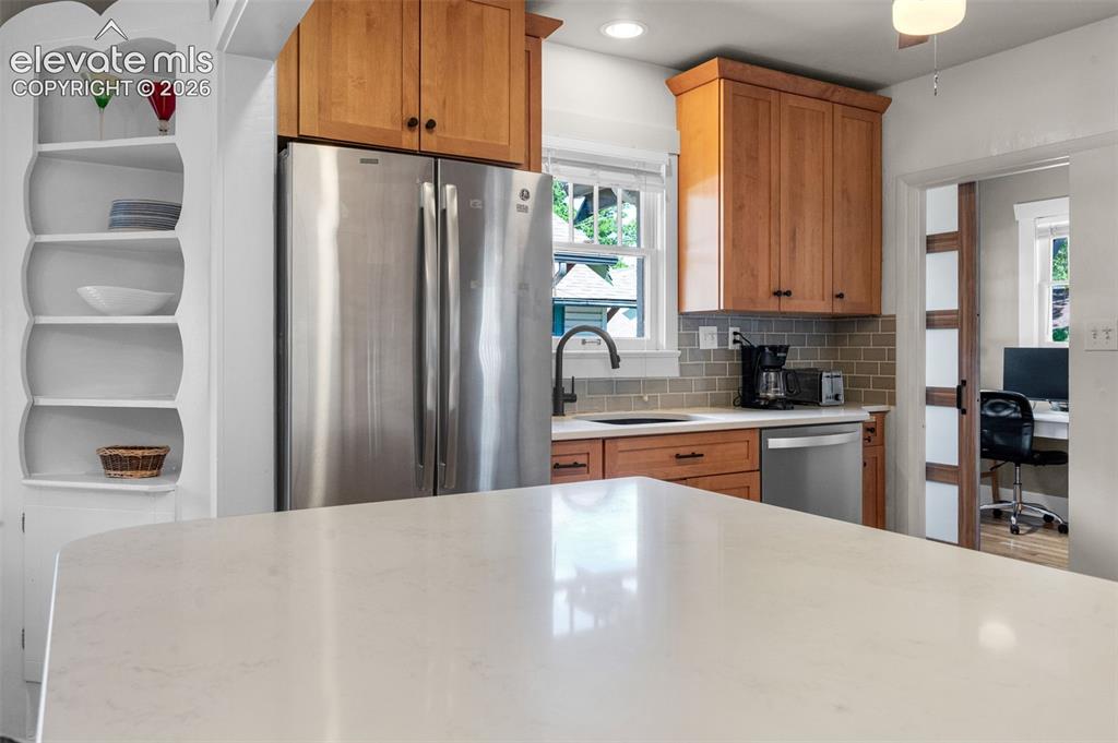 Image 15 of 48: Island area. Slider door into office or many different uses