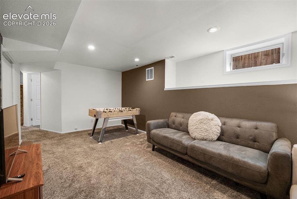 Image 31 of 48: Lower level family room