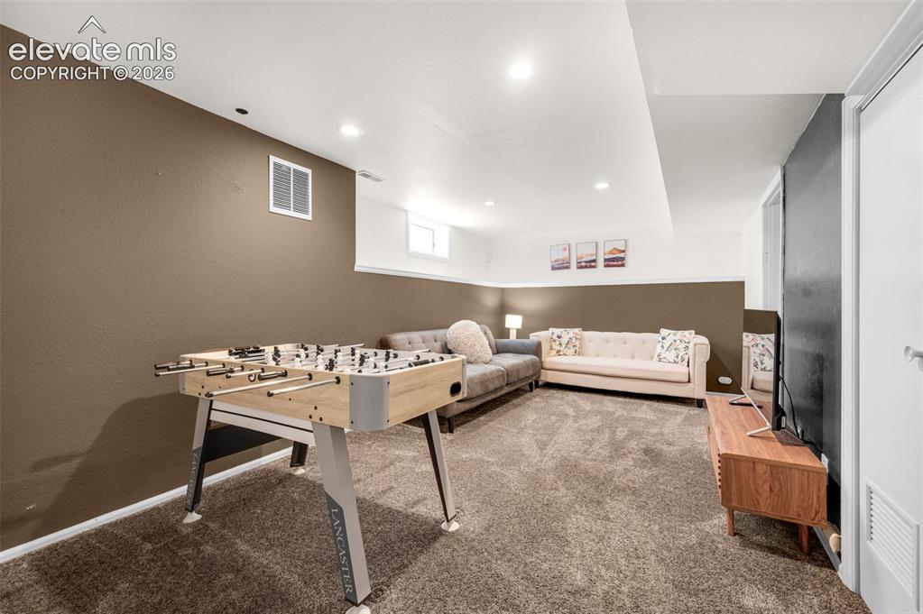 Image 32 of 48: Lower level family room
