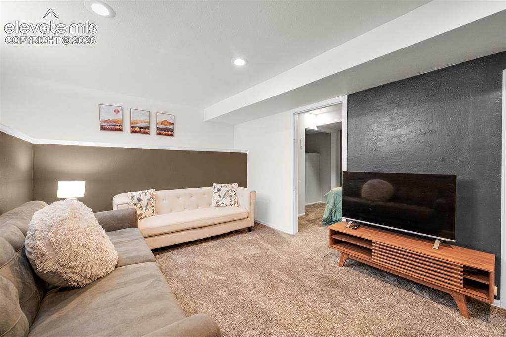 Image 33 of 48: Lower level family room
