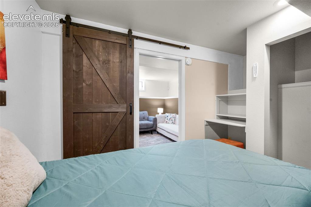 Image 36 of 48: Lower level nonconforming bedroom