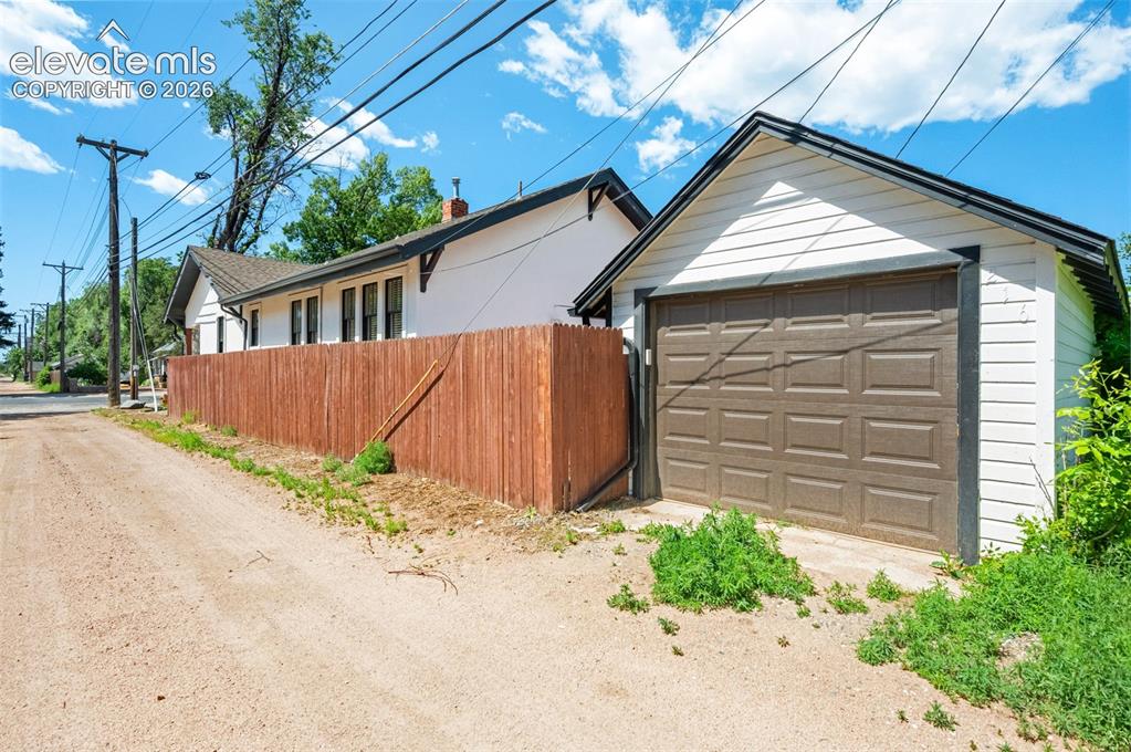 Image 42 of 48: Garage off alley