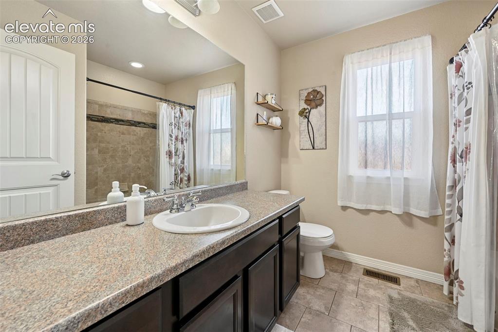 Image 29 of 48: Upstairs hall bathroom
