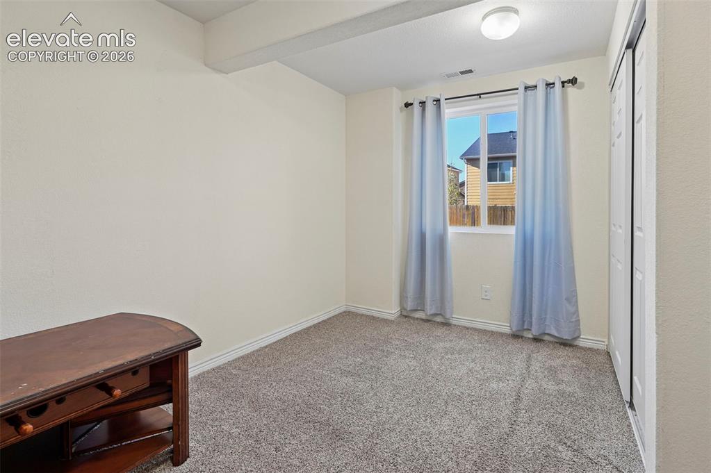 Image 38 of 48: Basement Bedroom