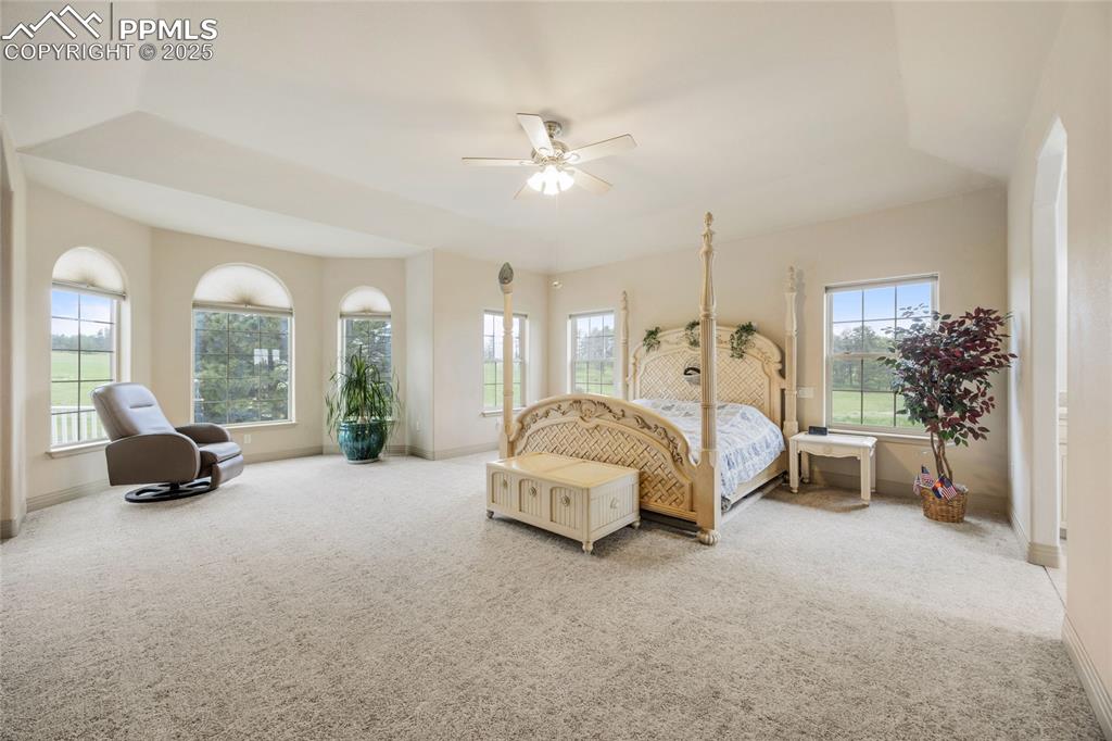 Image 28 of 41: Carpeted bedroom featuring baseboards and ceiling fan