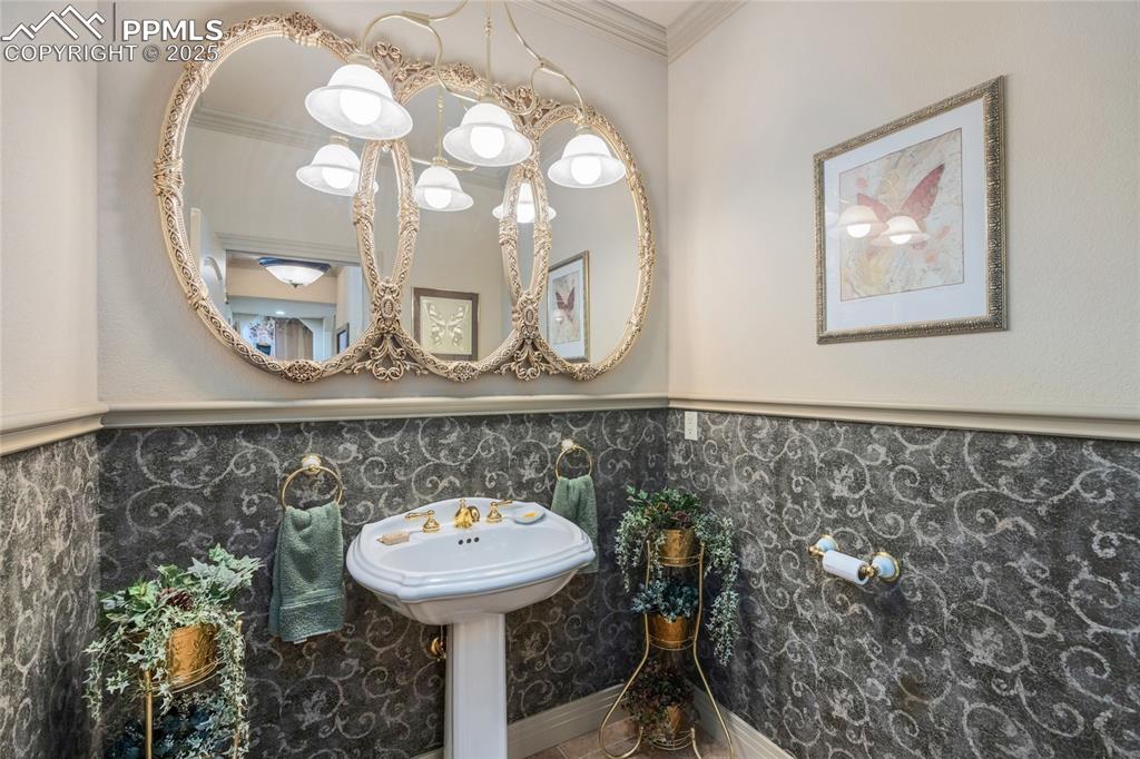 Image 33 of 41: Bathroom featuring ornamental molding