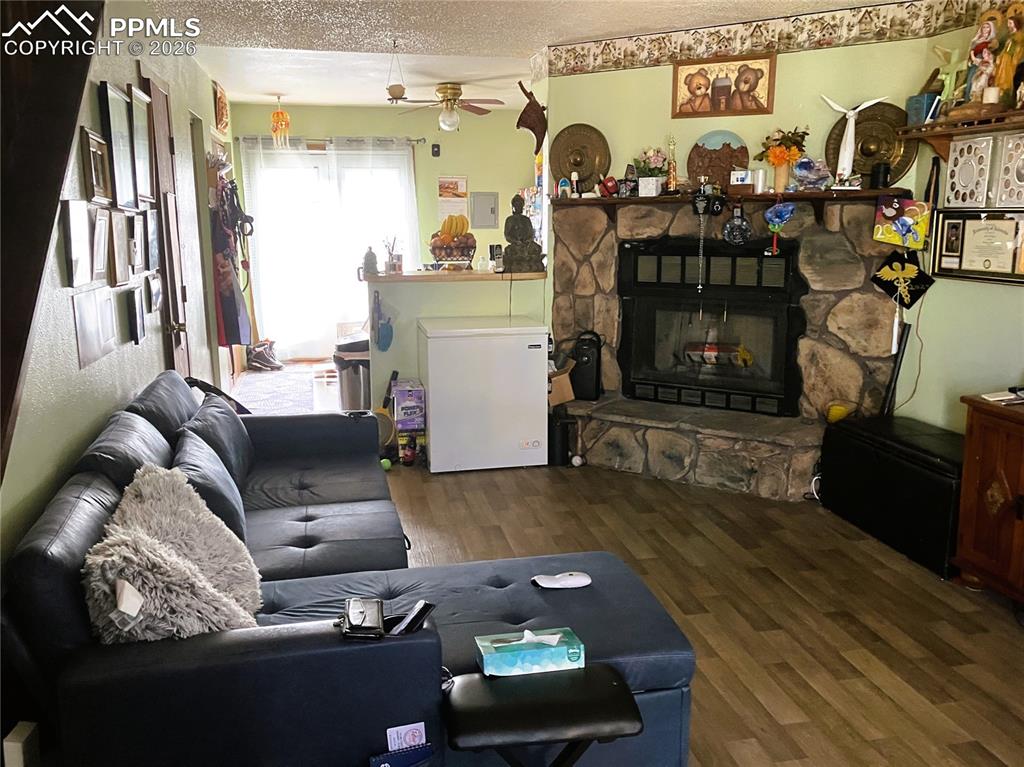 Image 5 of 13: View from family room towards kitchen and french doors leading to patio.