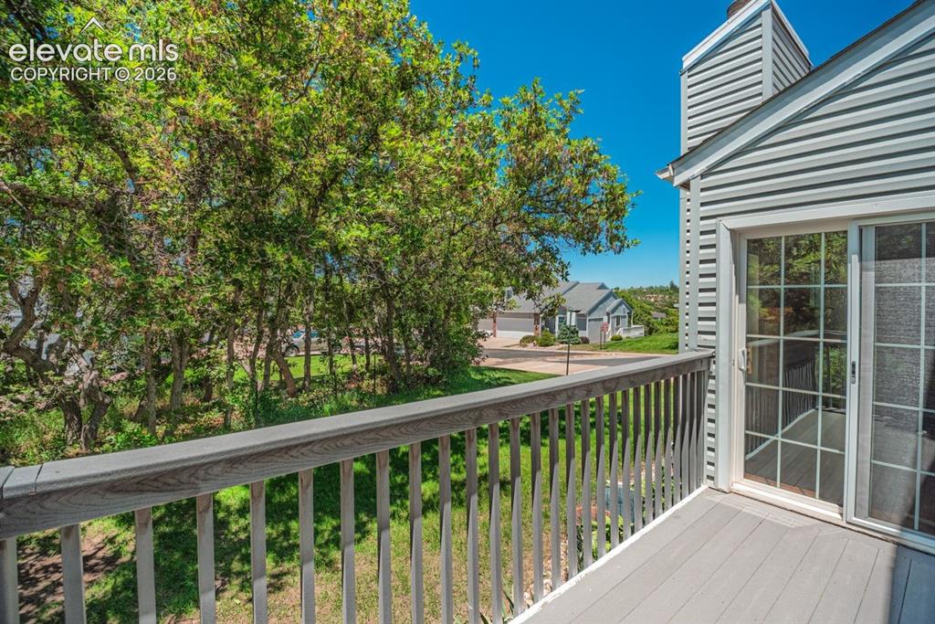 Image 33 of 36: Exterior balcony with composite decking and railing, offering an elevated p