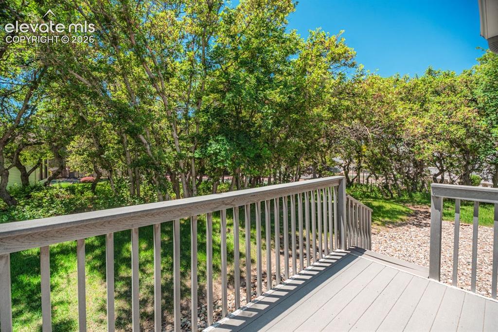 Image 34 of 36: Outdoor deck with composite plank flooring and matching railing system