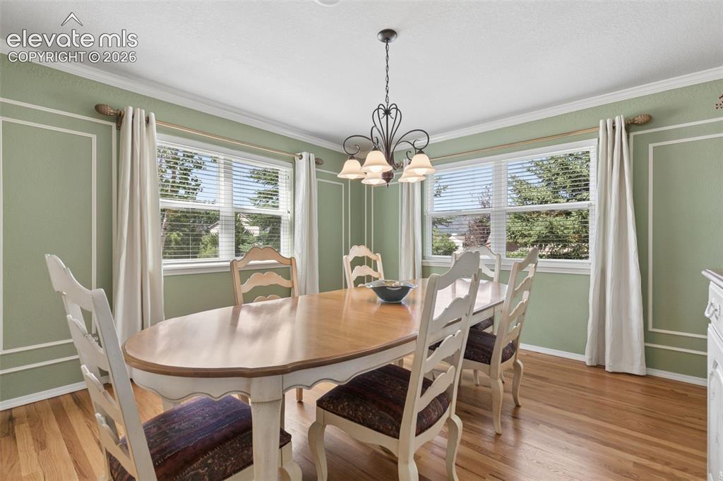 Image 14 of 49: Formal Dining Room with Custom Wall Panel Molding!
