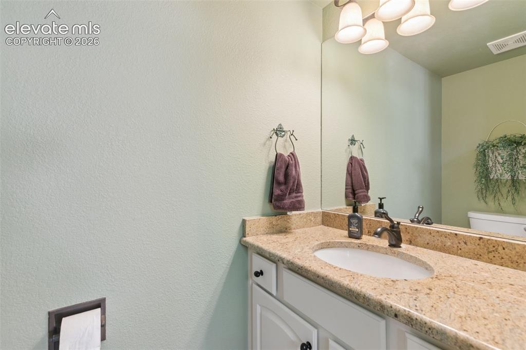 Image 17 of 49: Main Level Powder Room!