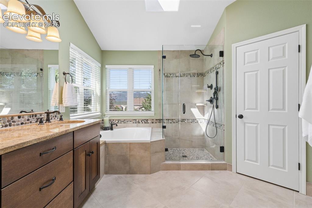 Image 25 of 49: Primary Bath with Soaking Tub, Spa Like Shower, and Walk-in Closet!