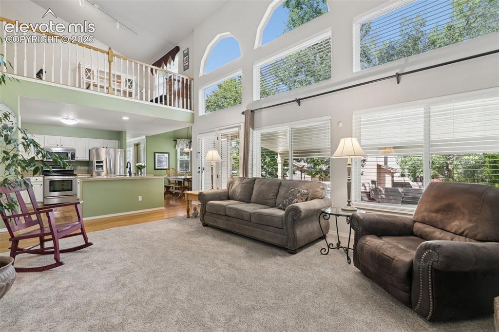 Image 6 of 49: Great Room with a Wall of Windows Showcasing a Ton of Natural Light!