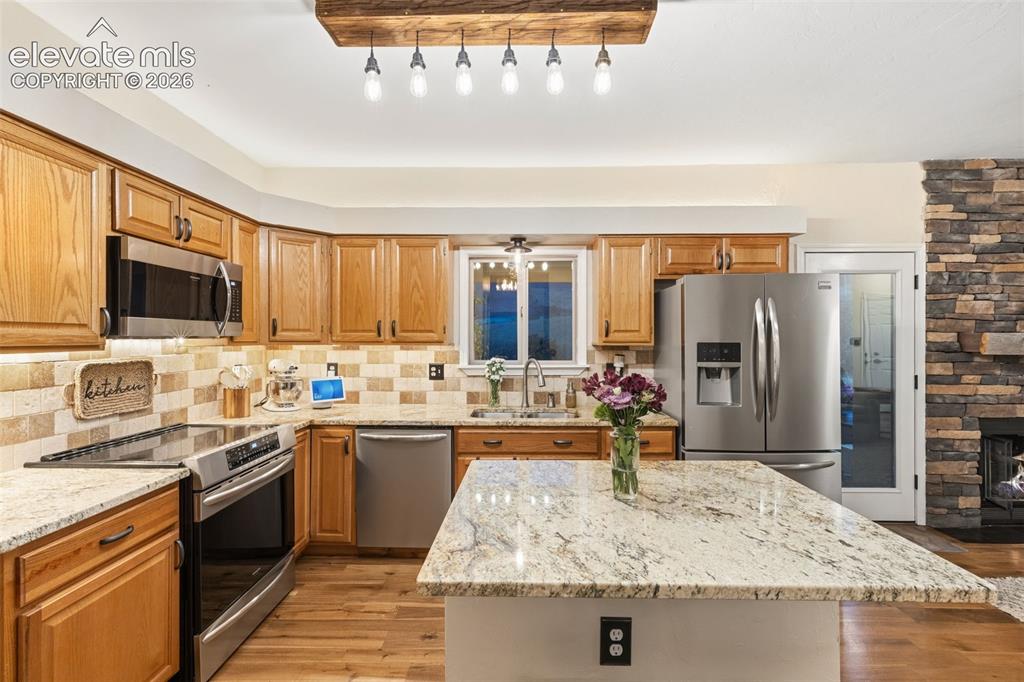 Image 10 of 46: Stainless Steels Appliances and Granite Counters.