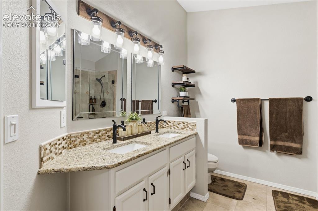 Image 28 of 46: Granite Countertops and New Fixtures