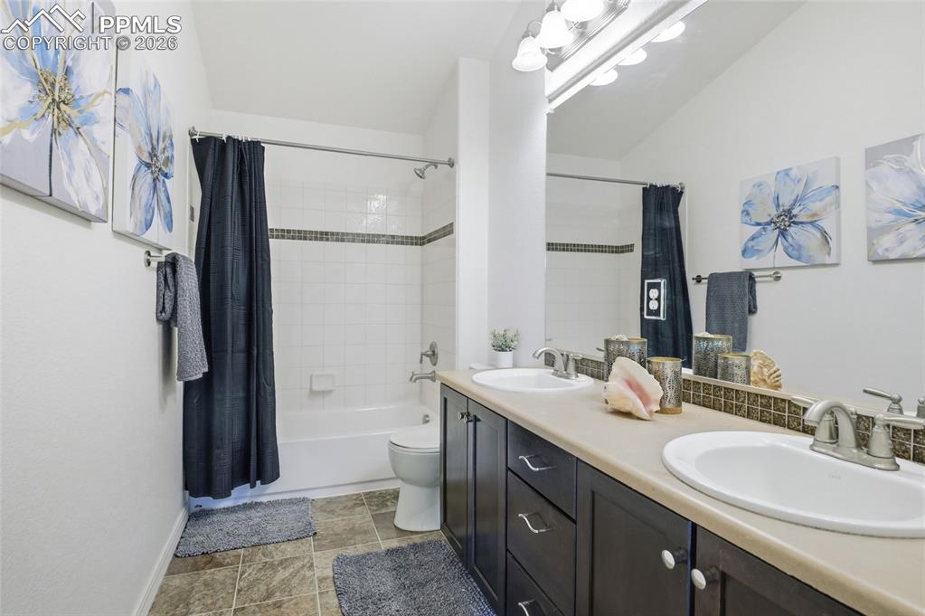 Image 35 of 49: SHARED BATHROOM UPSTAIRS WITH DOUBLE VANITY AND SHOWER/TUB COMBO