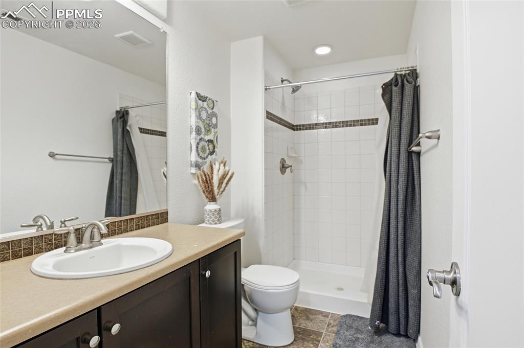Image 42 of 49: BASMENT BATHROOM