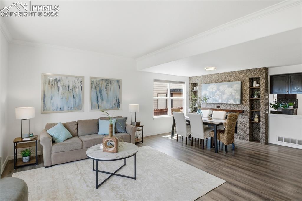 Image 5 of 49: REFRESHED INTERIOR FEATURING A STATEMENT FIREPLACE WITH TILE SURROUND EXTEN