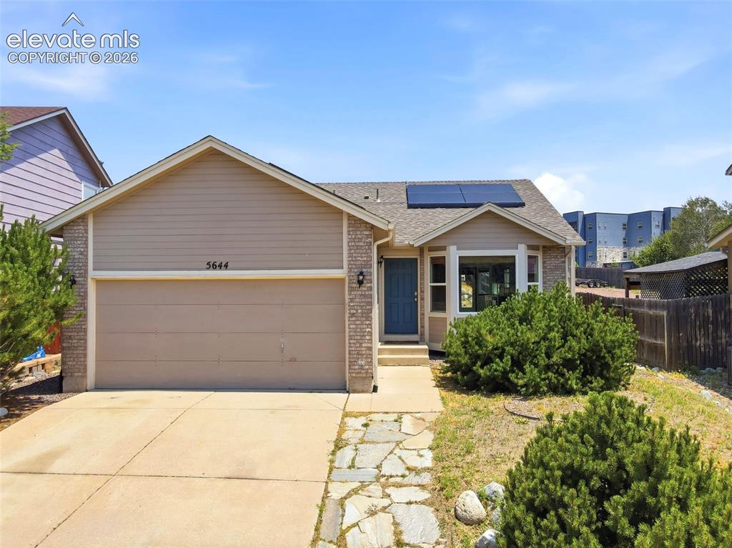 Image 1 of 48: Single-story residence featuring a brick and siding exterior, an attached g