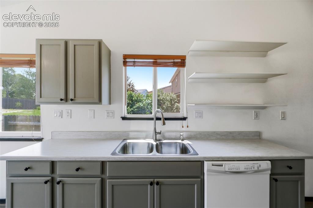 Image 10 of 48: Kitchen featuring an undermount stainless steel double sink, gray shaker-st