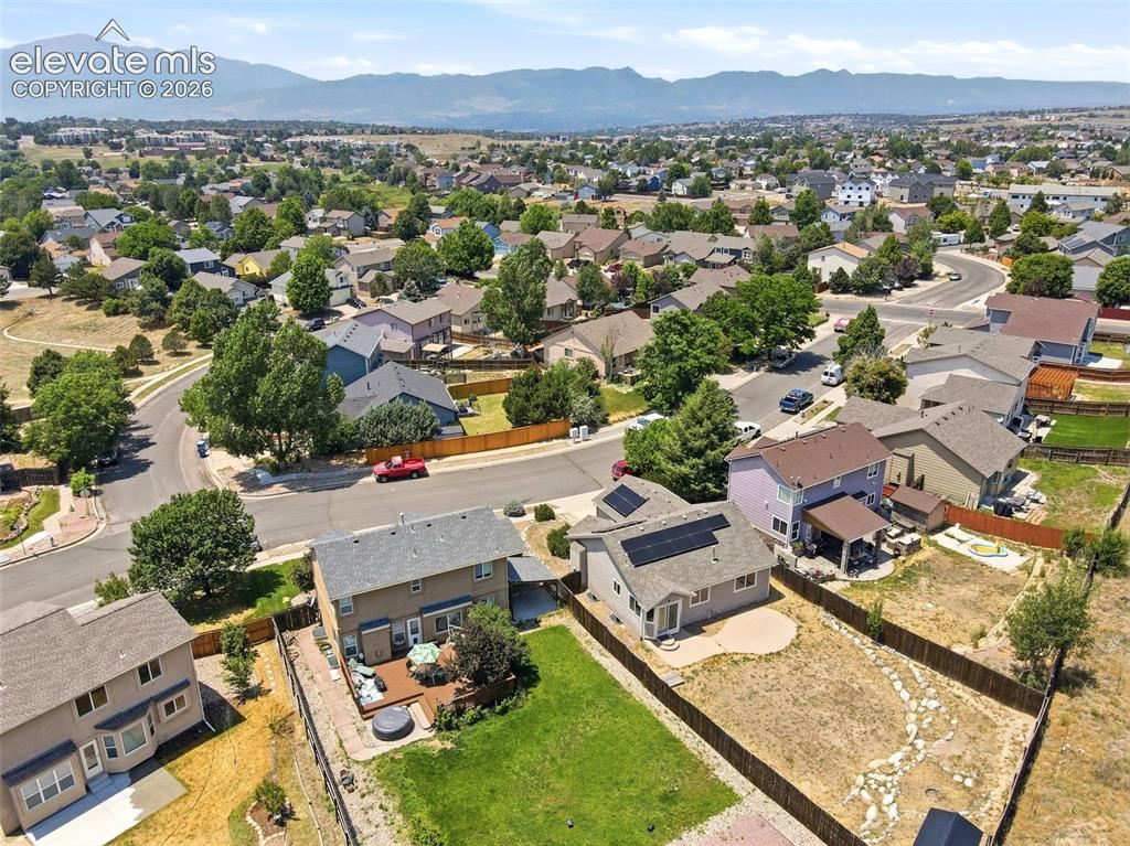 Image 40 of 48: Aerial perspective showcasing a residential neighborhood with distant mount