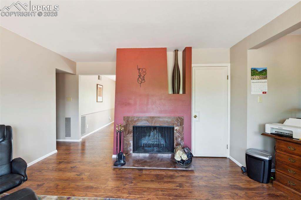 Image 7 of 20: Wood Burning Fireplace in the Living Room