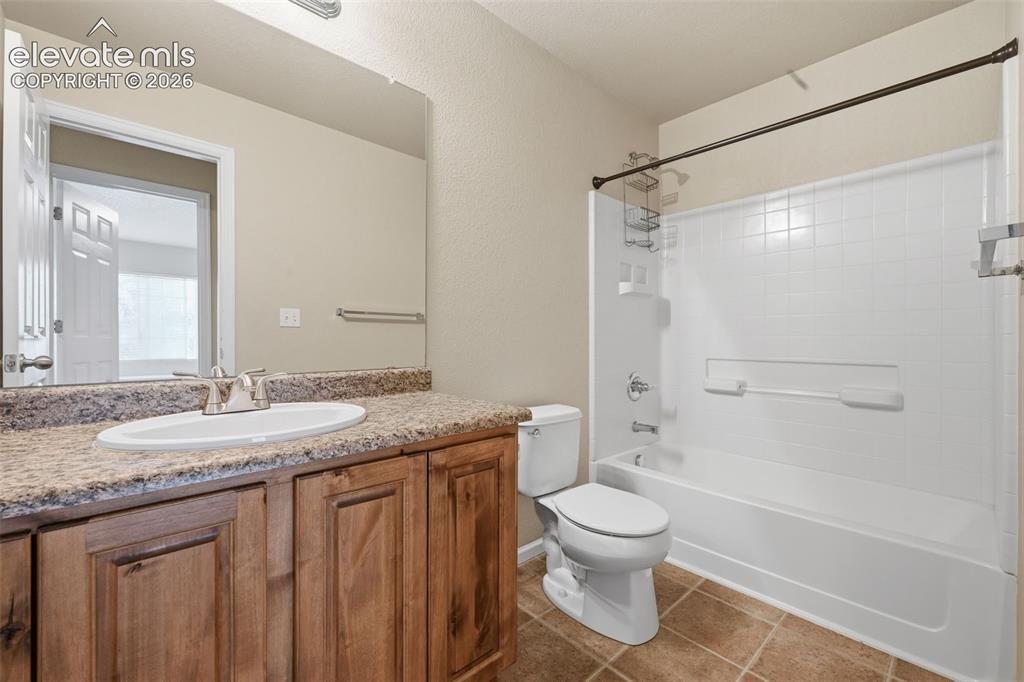 Image 23 of 33: Upper level full hallway bathroom. 