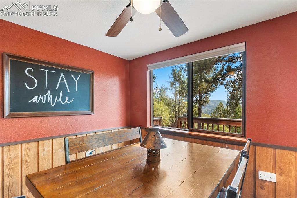 Image 12 of 50: Unfurnished dining area featuring a textured wall