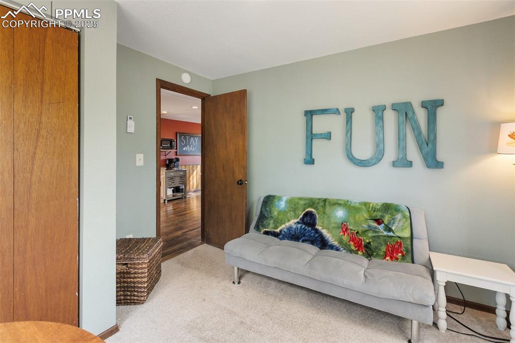 Image 17 of 50: Main level Bedroom featuring carpet floors