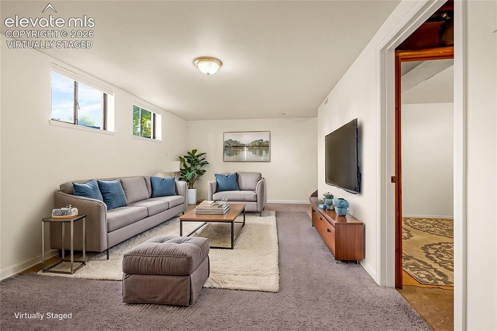 Image 18 of 43: Virtually Staged family room in basement