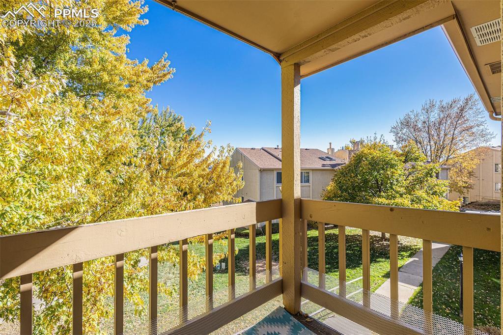 Image 13 of 19: Private deck with mature trees