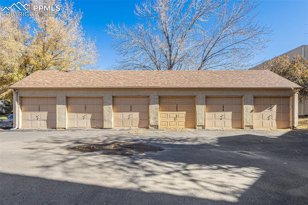Image 14 of 19: 1 car detached garage plus an extra assigned parking space!