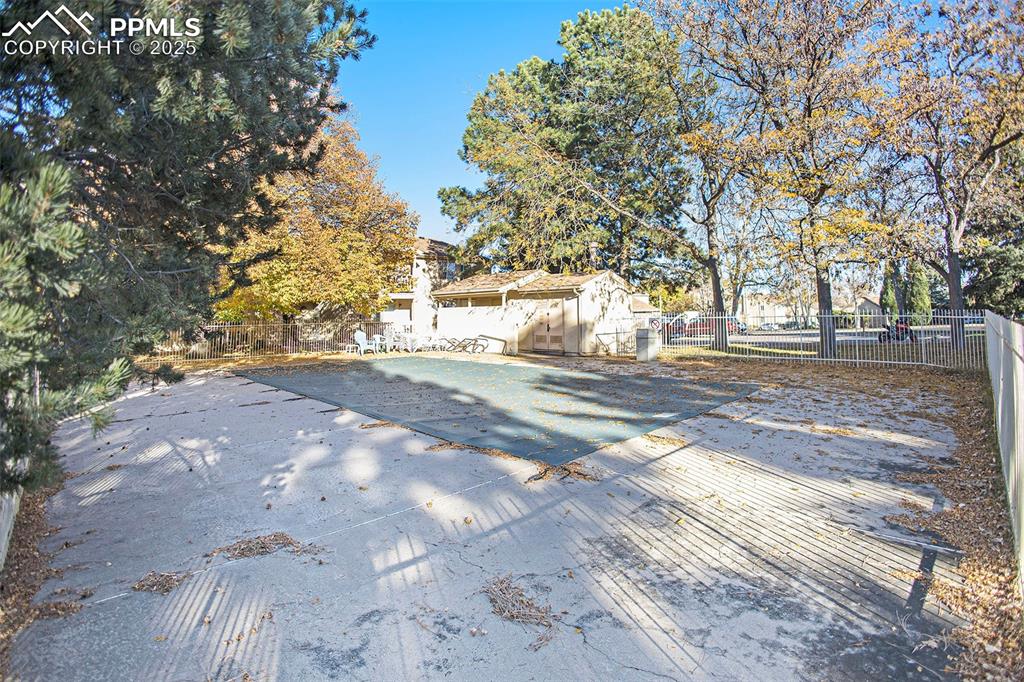 Image 16 of 19: Pool is covered for winter, but sparkles in the summer!