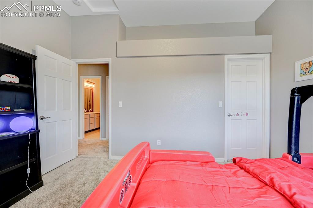 Image 24 of 31: Carpeted bedroom featuring baseboards and a closet